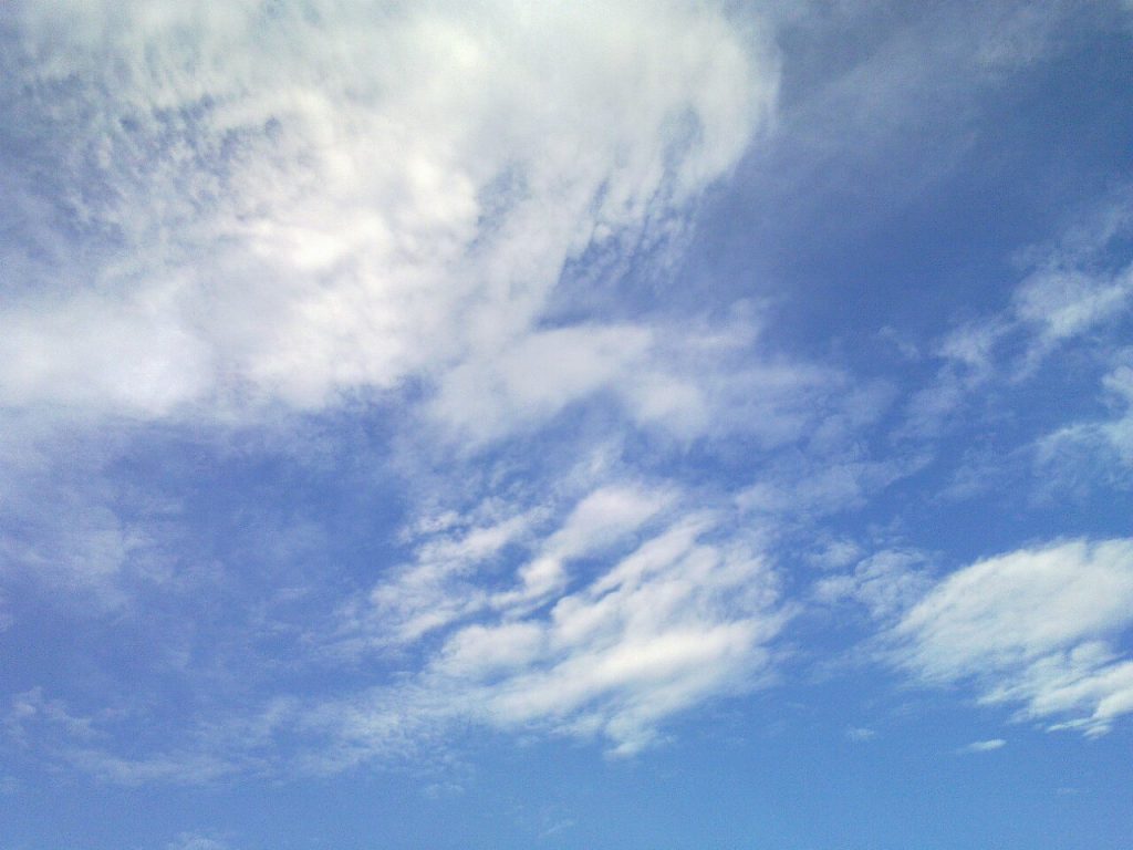 Blue sky with wisps of clouds