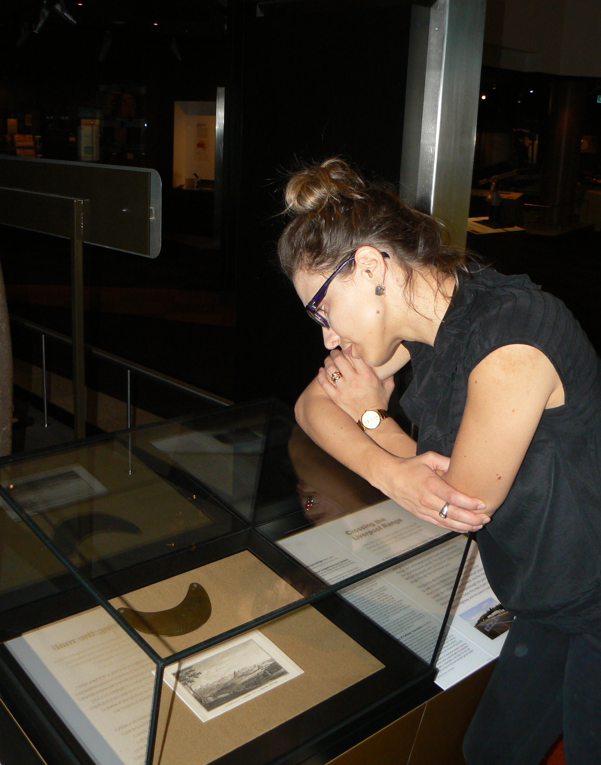 Curator Karolina Kilian wonders at the hidden stories locked away in the breastplate. Photo by Jennifer Wilson, National Museum of Australia