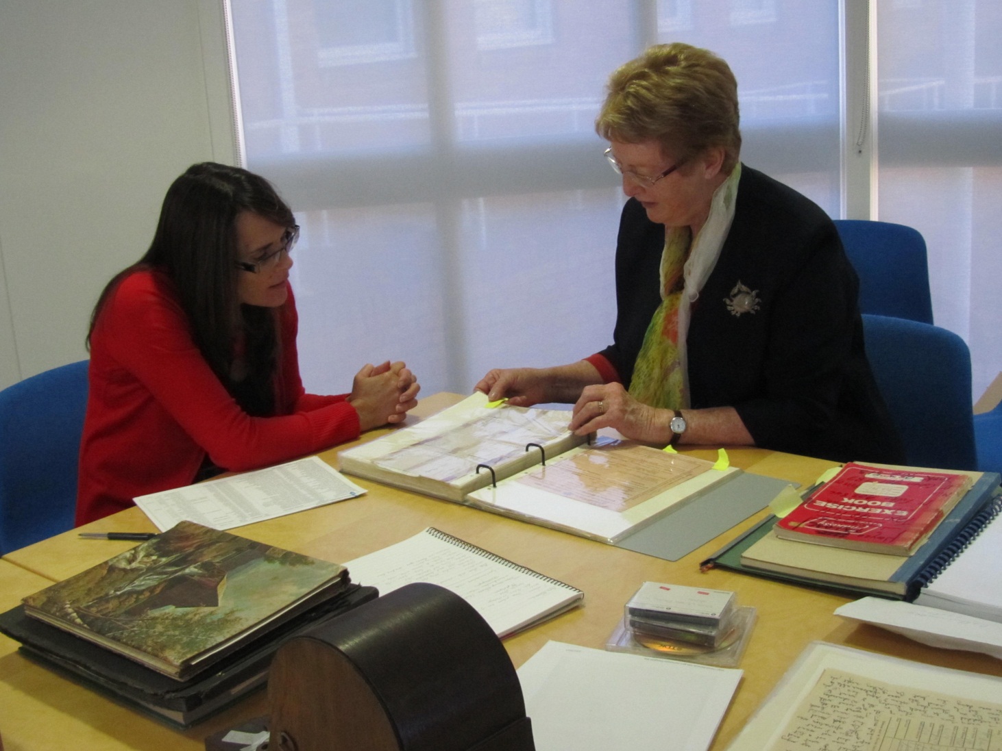 Two ladies at a desk.