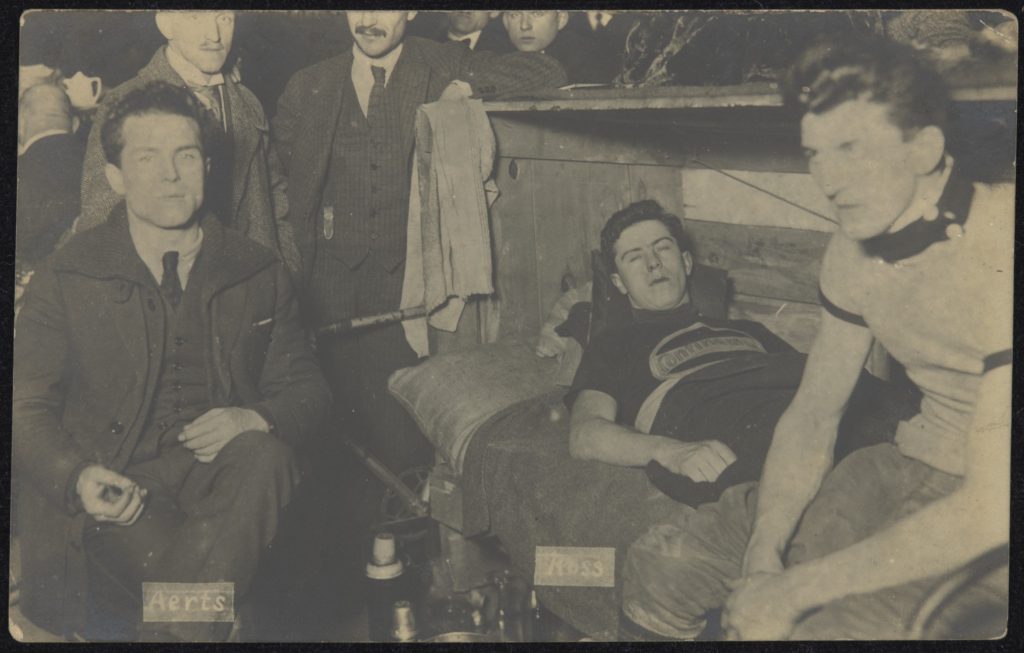 This image shows Australian cyclist, Ken Ross, centre, with his trainer, right, and Belgian cycling champion, Emile Aerts. The photograph was taken after the finish of the Berlin six-day race in February 1922. According to Ross, ‘the Sydney Six-Days race … was only a training ride alongside of these’.