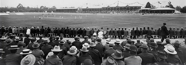 The Adelaide Oval, second day of the third test between Australia and England, 20 January 1902. Australia won by 4 wickets. "The English skipper commenced the day with a vigorous bombardment by his artillery, and the little Gunn proved a veritable Long Tom in his destructiveness. The batsmen offered resistance for a while, but he hurled his ammunition with such deadly precision that all opposition was futile, and the Australian side succumbed to the vigorous attack. Gunn conquered five wielders of the willow at a cost of 76 runs." The Register newspaper, Tuesday 21 January 1902.