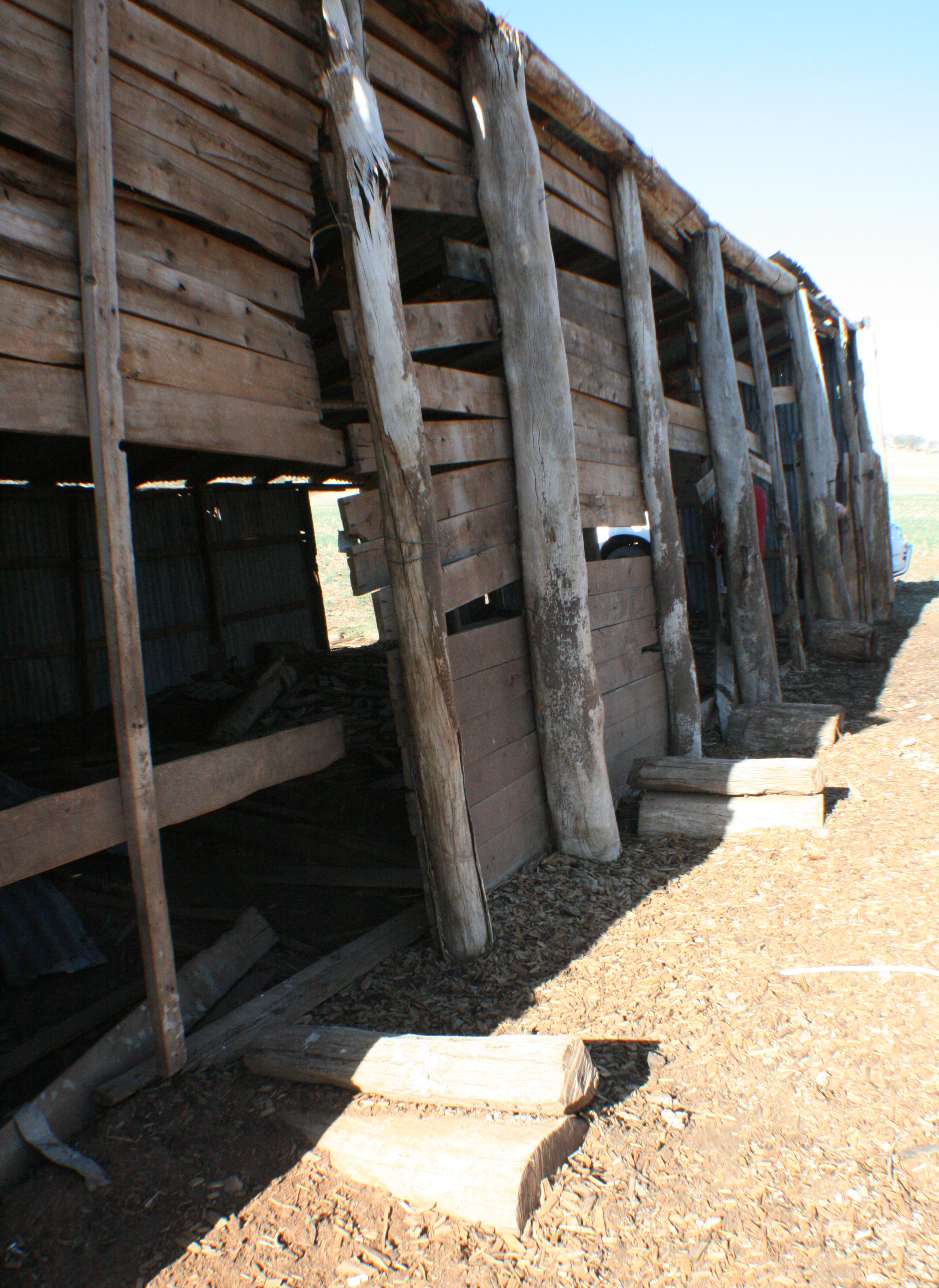 Side of the chaff shed showing the footings for the horse trough.  Photo by Jennifer Wilson, National Museum of Australia.