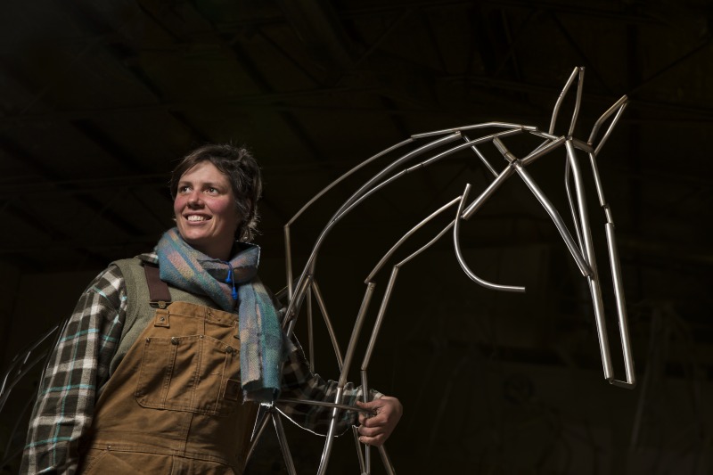 Harrie Fasher and one of the horse mannequins used in the Spirited exhibition, 2014. Photograph by Jason McCarthy  National Museum of Australia