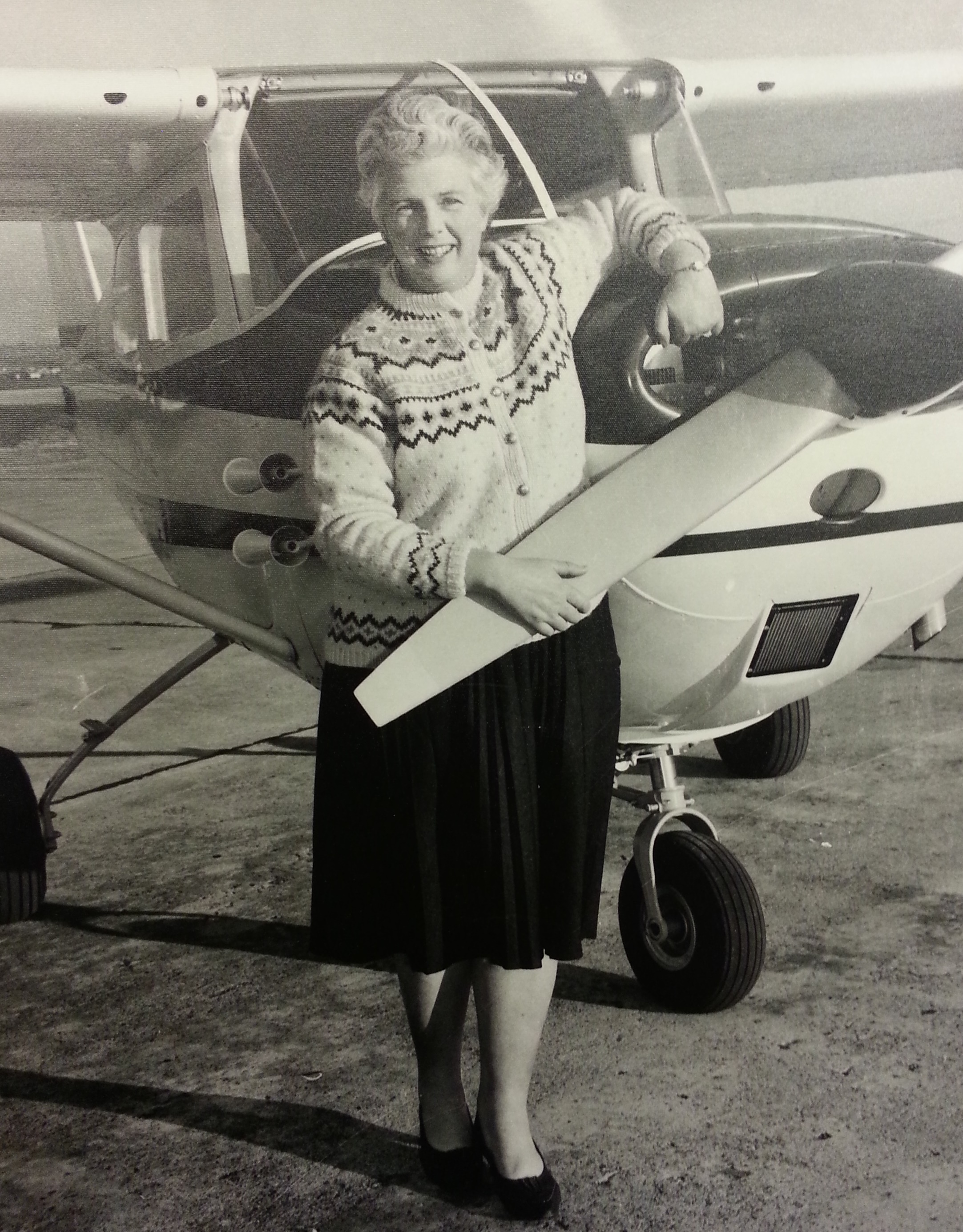 Lady Blackburn standing in front of her Cessna